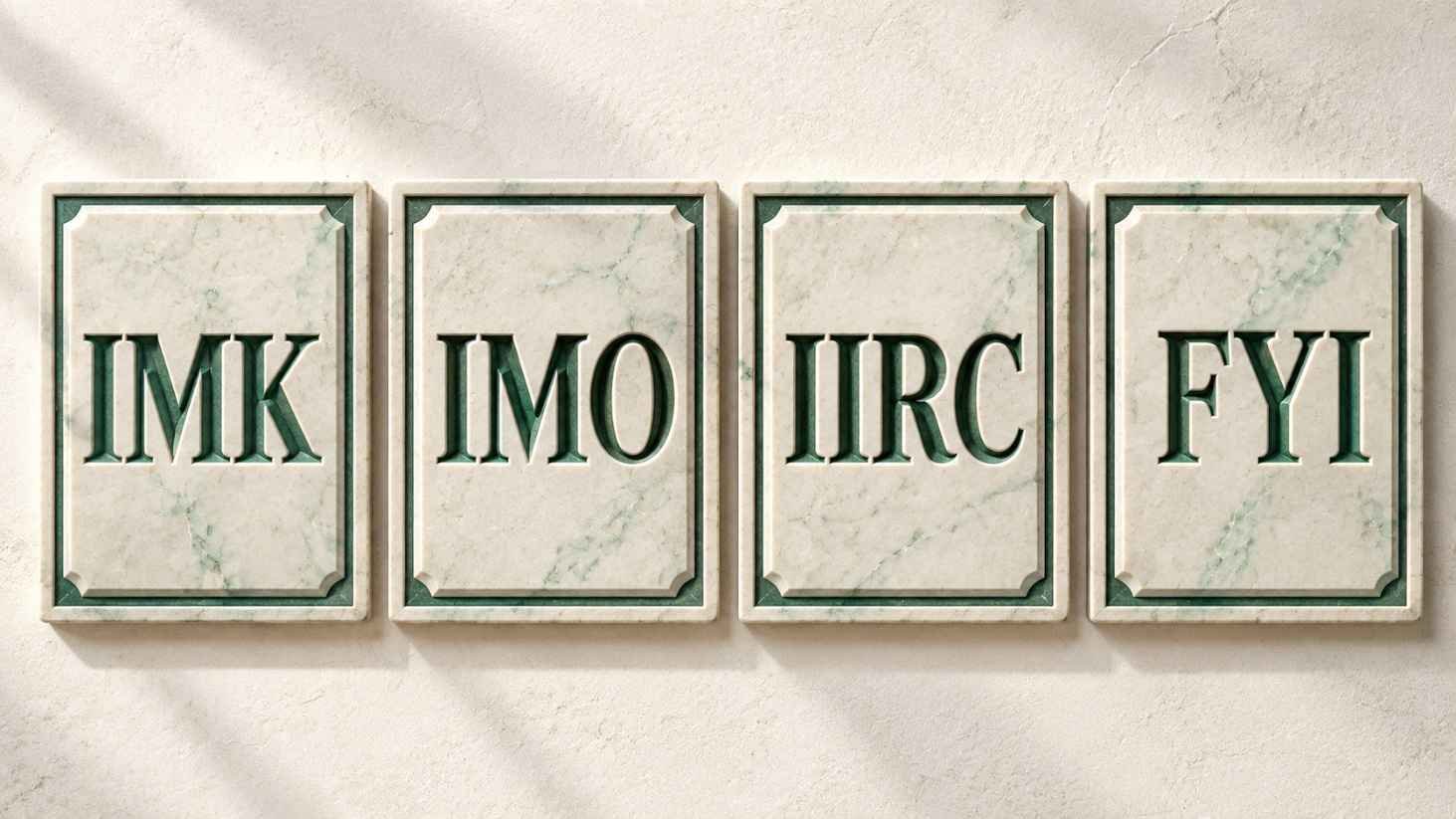 Four carved stone tablets comparing the acronyms IMK, IMO, IIRC, and FYI