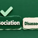 Two paper-cut word blocks reading dissociation and disassociation, with a green check mark above the first